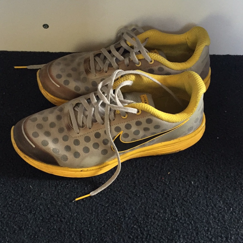 Yellow live strong Nike running shoes